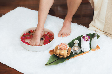 Man indulges in blissful foot massage at luxurious spa salon while masseur give reflexology therapy...