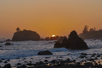 USA, California, Crescent City. Seastack along coastline at sunset