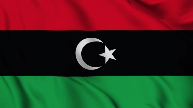 libyan national flag video waving in wind. Realistic flag background. Close up view, perfect loop, 4K footage.