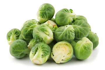 Obraz premium Fresh green Brussels sprouts piled on a white background.