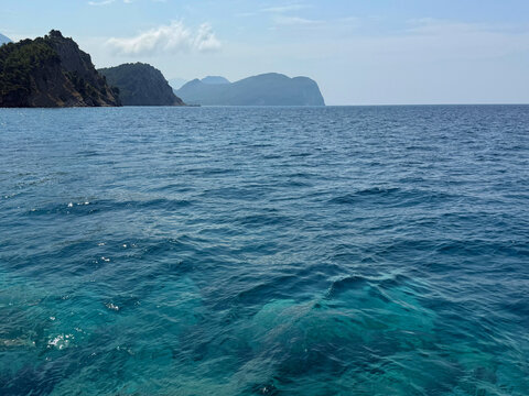 Blue Mediterranean sea and rocky coast.