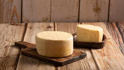 Minas Cheese, Delicious semi-cured cheese from Minas Gerais, Brazil, on rustic wood, selective focus.
