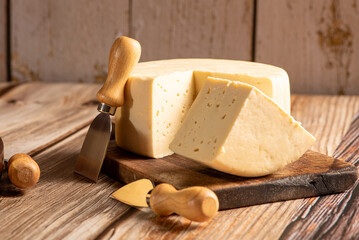 Minas Cheese, Delicious semi-cured cheese from Minas Gerais, Brazil, on rustic wood, selective focus.