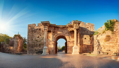 Fototapeta premium hadrian gate also known as the uc kapilar at the entrance to antalya old town or kaleici on a sunny day
