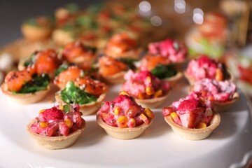 Buffet menu. Tasty stuffed tartlets on stand, closeup
