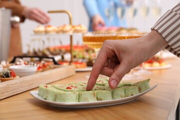 People with different appetizers at buffet, selective focus