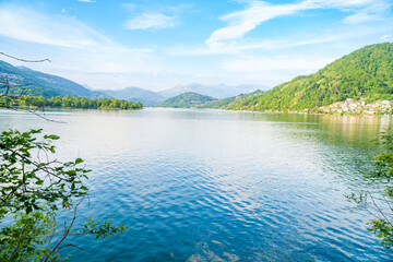 Spring view of Lake Lugano in the town of Caslano in the Swiss mountains