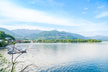 Spring view of Lake Lugano in the town of Caslano in the Swiss mountains