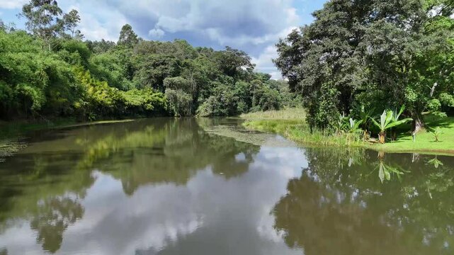Drone flight over Lower Saosa Dam near Mau Forest, Kericho, Kenya, revealing a calm body of water