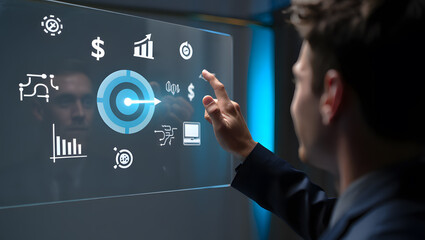 A businessman interacts with a futuristic transparent screen displaying financial data graphs charts and business strategy icons representing growth goals and target achievement.