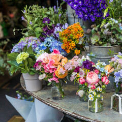 A beautiful display of fresh flowers in front of a historic building.