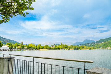 Spring view of Lake Lugano in the town of Caslano in the Swiss mountains