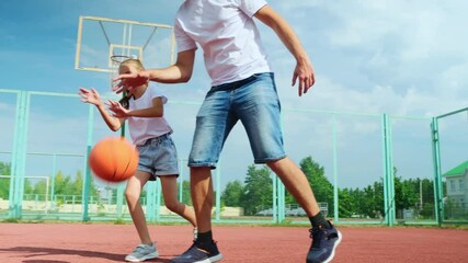 Father and daughter playing basketball in sport court - Powered by Adobe