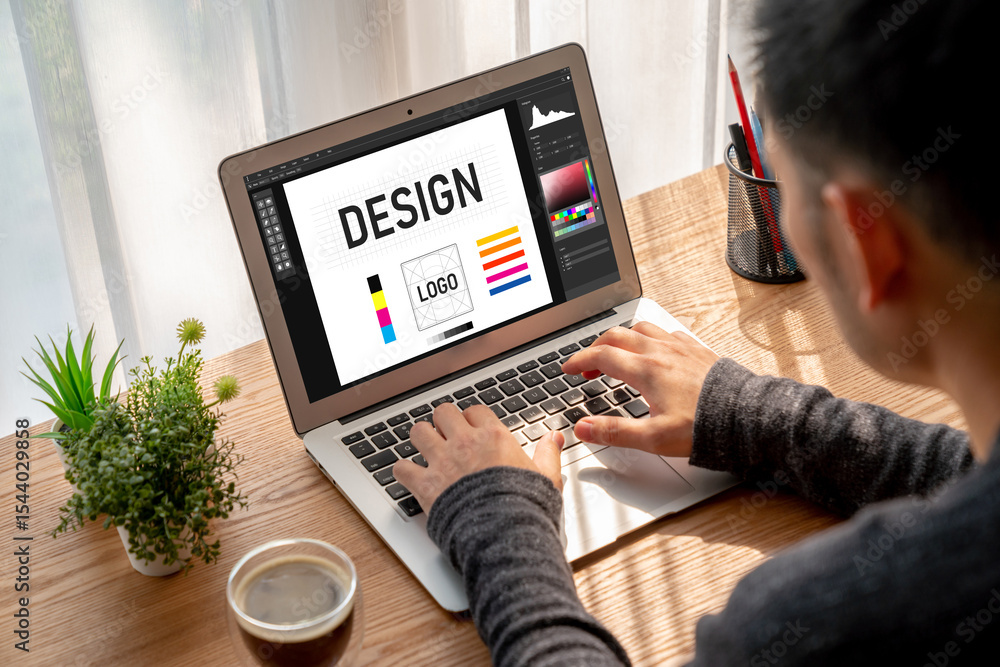 Aufkleber graphic designer software for modern design of web page and commercial ads showing on the computer s