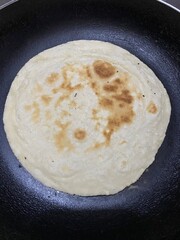 Homemade bread cooked in a pan. roti or chappati or Indian flat bread made from wheat. fresh...
