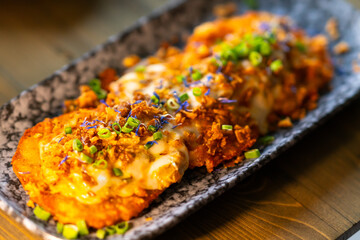 There are potato pancakes on the plate.