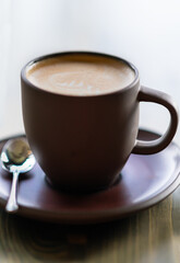 A close up of a cup of cappuccino.