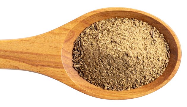 Ground cumin in wooden spoon.
