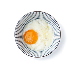 Half-boiled egg in bowl isolated on white, top view. Traditional asian breakfast