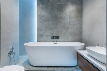 Stylish interior design of the bathroom, decorated with gray marble tiles. The original 
backlight....