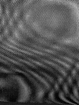 abstract background of a chair fabric with tiny geometric shapes