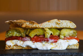 Ciabatta with roasted red pepper, burrata and pickles