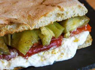 Ciabatta with roasted red pepper, burrata and pickles