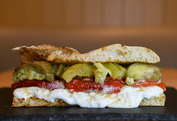 Ciabatta with roasted red pepper, burrata and pickles