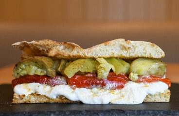 Ciabatta with roasted red pepper, burrata and pickles