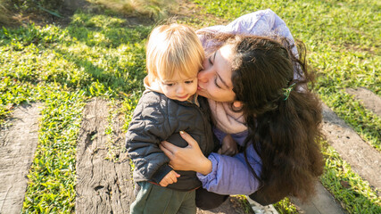 A woman is holding a baby