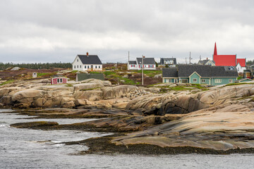 Fishermen cottages overlooks the harbour of Peggys Cove near Halifax in Nova Scotia, Canada