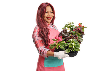 Asian female florist with a tray of flowers