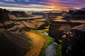 Dark sunset skies over the Palouse Gorge canyon and river at Palouse Falls State Park in Southeastern Washington State.