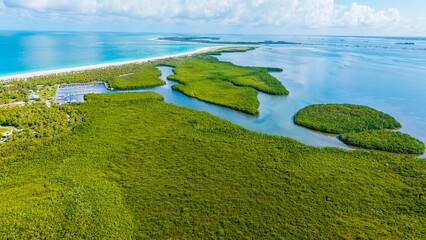 Drone View of Caladesi Island and Marina with Hurricane Pass and Honeymoon Island in the distance.  This is Florida Gulf coast paradise from the air.