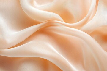 Obraz premium Peachy silk fabric with flowing folds.
