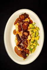 Rustic pork tenderloin with mashed avocado and mashed potatoes over a light natural light. Perfect for a healthy meal of gourmet cuisine.