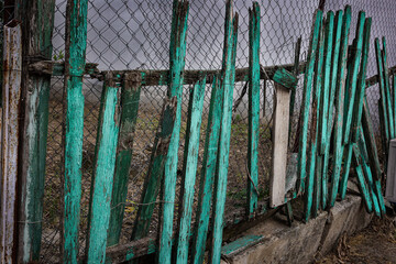 Wooden Fence with Peeling Green Paint