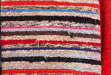 multicolored textile carpet in exposition on market