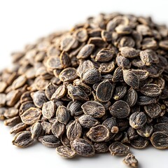 A close up image of a pile of dark brown seeds on a white background healthy food