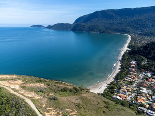 Wonderful beach with turquoise water in the middle of a village in the Atlantic Forest