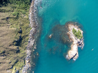amazing turquoise blue sea water with sea stones
