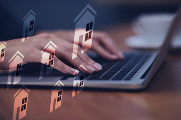 Real estate agent looking for housing via laptop at table, closeup. Illustrations of buildings as...