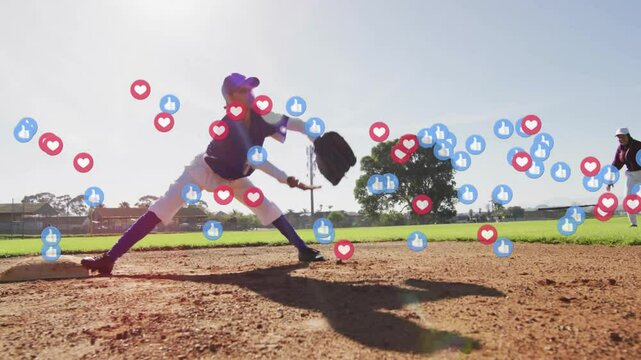 First baseman bracing at base while softball overlay releasing hearts, thumbs-up tagging runner