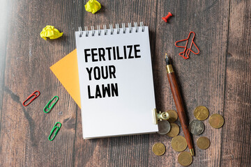 Sign on a green lawn - Fertilize your lawn
