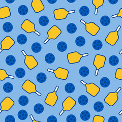 Seamless pattern of yellow pickleball paddles and blue perforated balls on blue background.