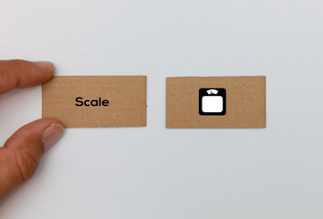 SCALE concept on cardboard cards