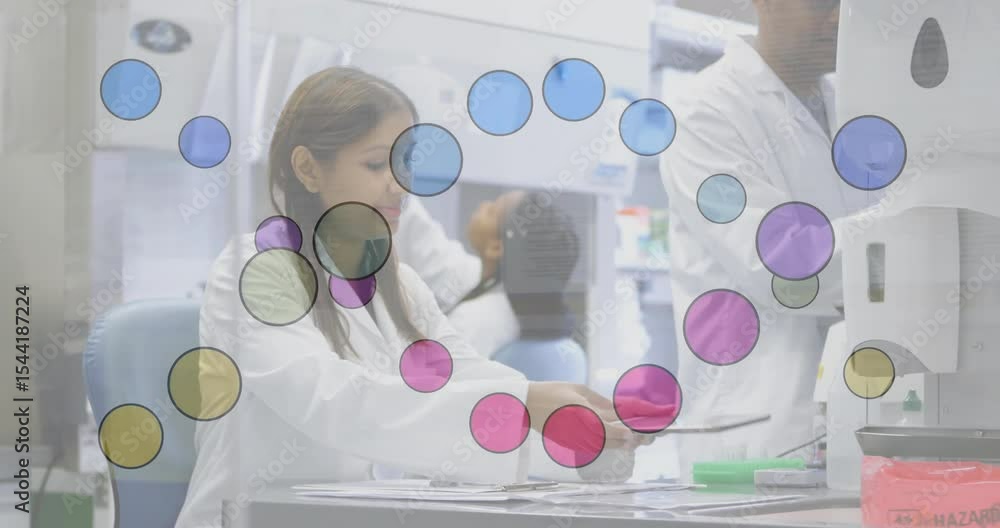 Poster indian female lab technician organizing slides then tapping tablet displaying data in research lab