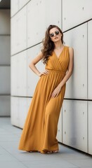 Fototapeta premium Stylish Woman in Mustard Yellow Maxi Dress, Summer Fashion