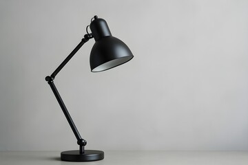 Sleek Brushed Metal Desk Lamp with Modern Arc Design on a Clean Surface Background