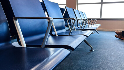 Photo of free airport chairs on one side and feed on passages on other site. Concept traveling, waiting, flights, delayed, crisis, airline, shutdown, aviation, charts.